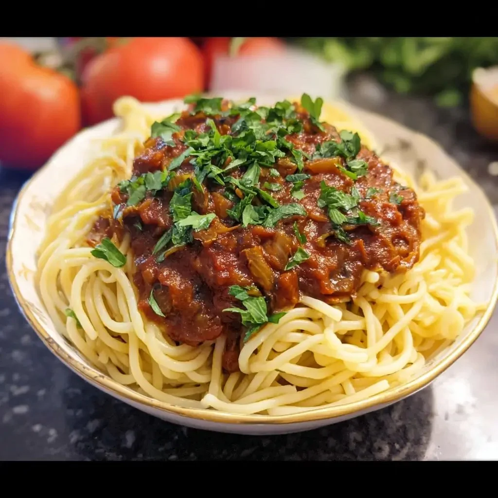 One Pot Vegan Mushroom Bolognese served in a bowl with fresh herbs