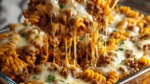 Delicious Cheesy Hamburger Casserole Bake in a baking dish topped with melted cheese