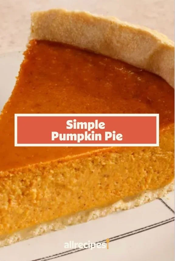 Slice of classic pumpkin pie with whipped cream on a plate