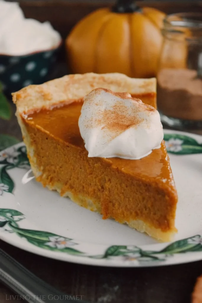 Delicious classic pumpkin pie with whipped cream on top