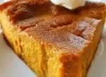Delicious crustless pumpkin pie served on a wooden table with autumn decorations