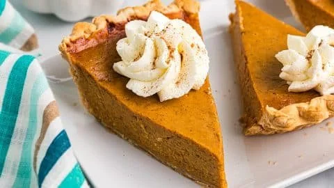 Homemade easy pumpkin pie served with whipped cream