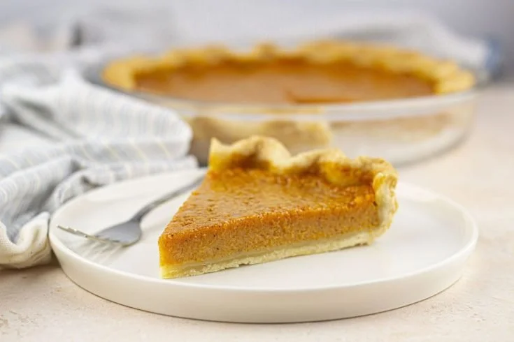 Homemade pumpkin pie made with fresh ingredients and spices.