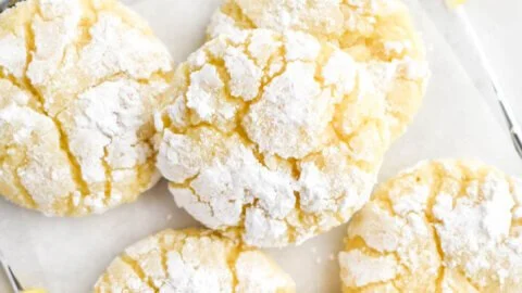 Freshly baked Lemon Crinkle Cookies with powdered sugar on top.