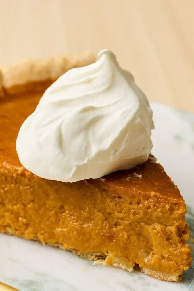 Homemade Libby's Famous Pumpkin Pie with whipped cream topping