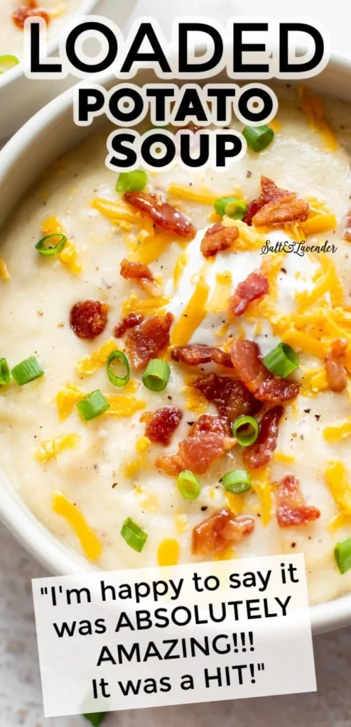 Bowl of loaded potato soup topped with cheese, bacon, and green onions