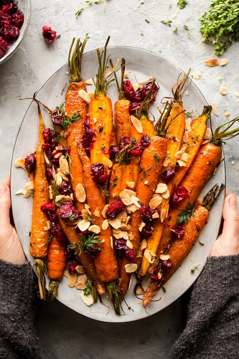 Maple roasted carrots with cranberries on a serving plate