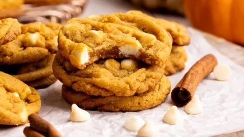 Freshly baked Pumpkin White Chocolate Chip Cookies on a cooling rack